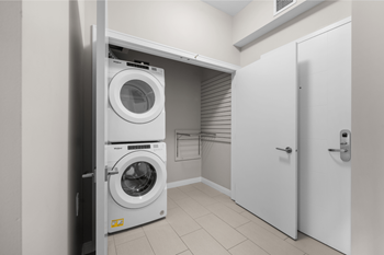 A laundry room with a washer and dryer in it.